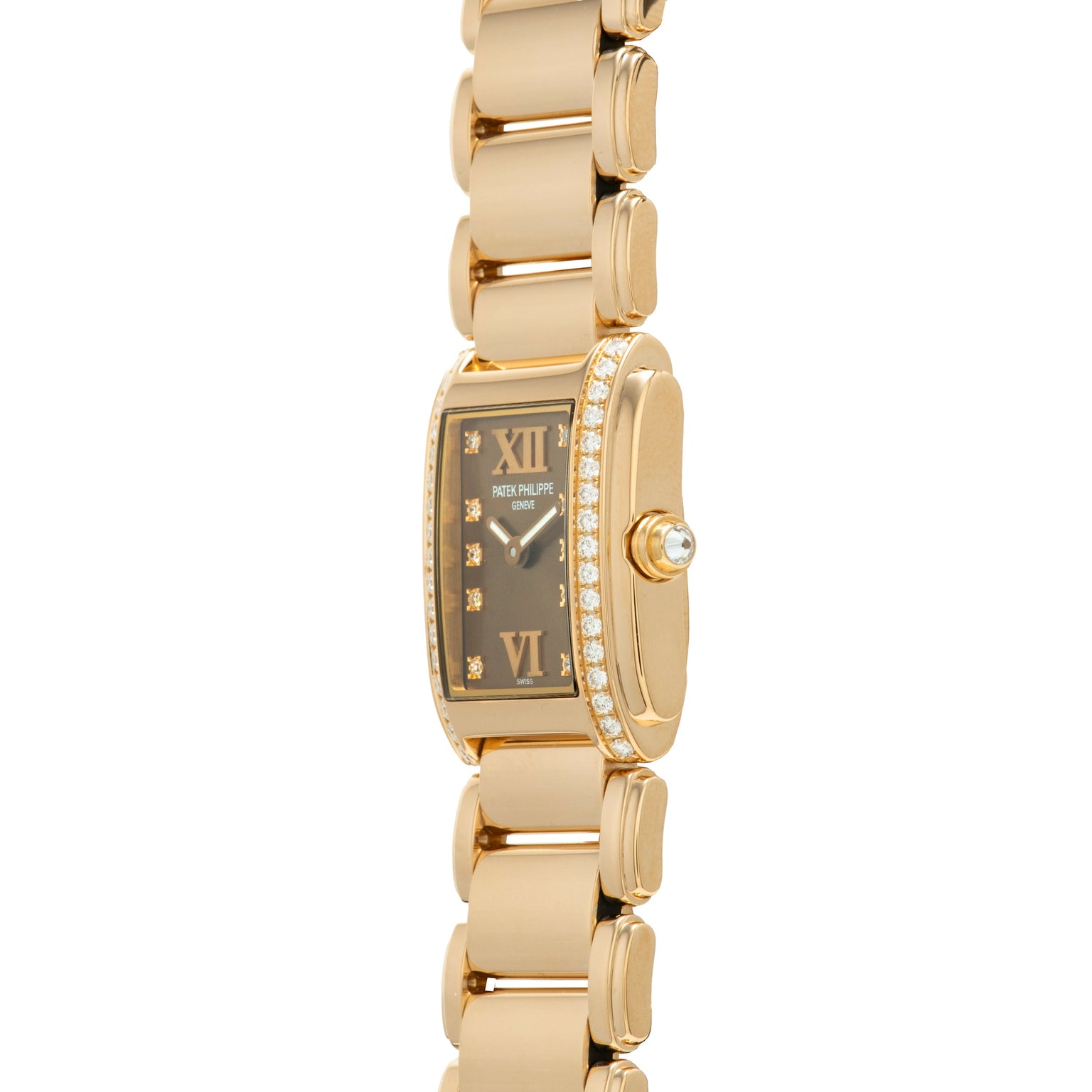 Patek Philippe Twenty-4 gold wristwatch with a rectangular face, diamond bezel, and link bracelet, pictured from a side angle.