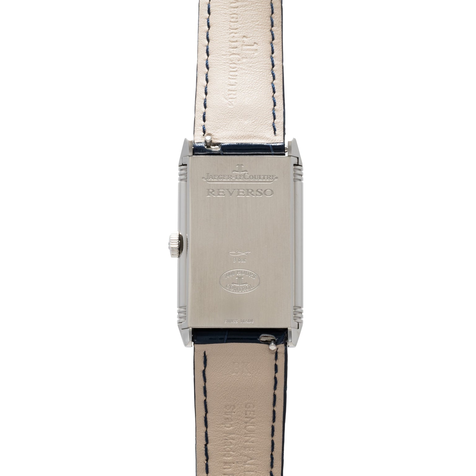 The Jaeger-LeCoultre Reverso Classique Ladies features a silver rectangular case with Reverso engraving and a beige leather strap with visible stitching.