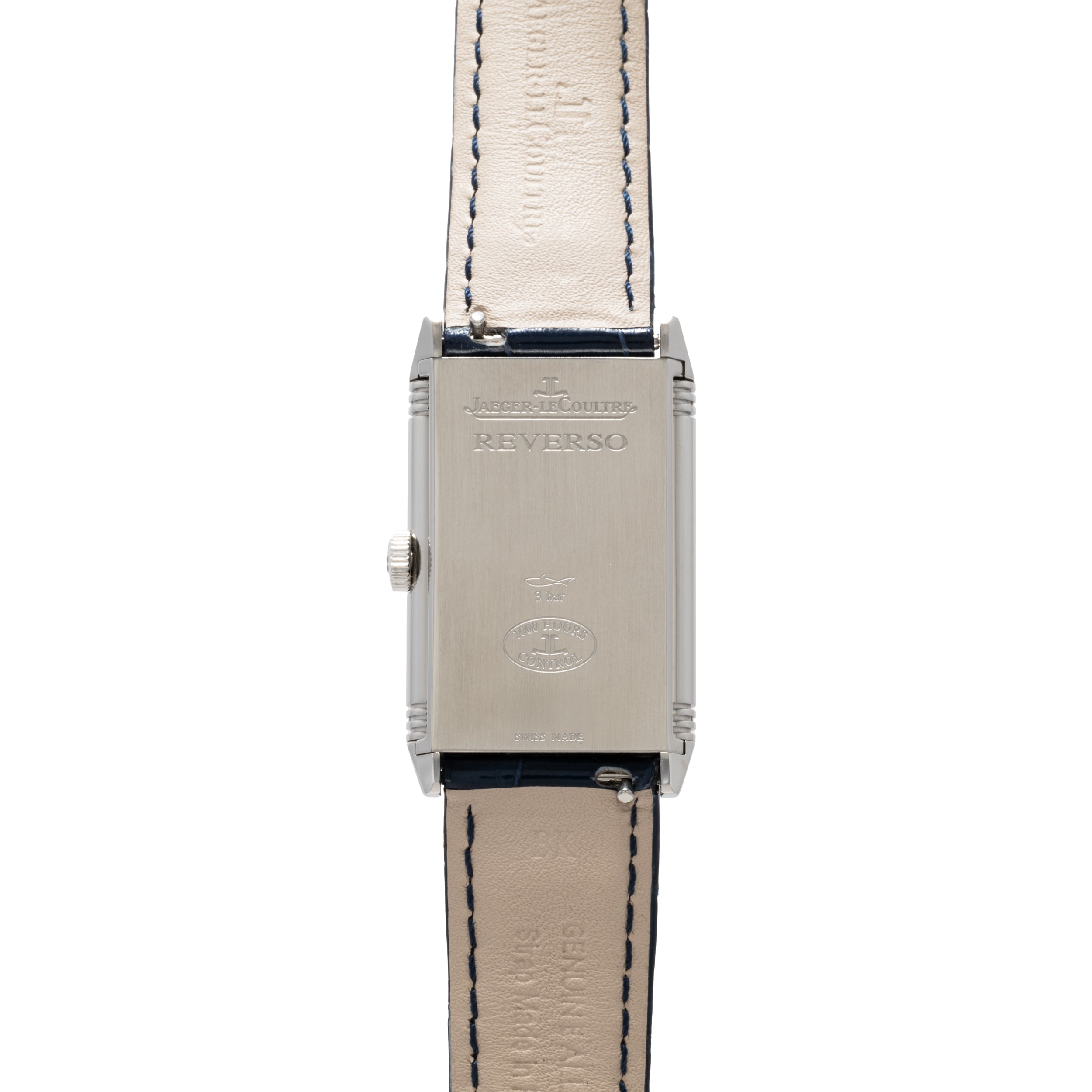 The Jaeger-LeCoultre Reverso Classique Ladies features a silver rectangular case with Reverso engraving and a beige leather strap with visible stitching.