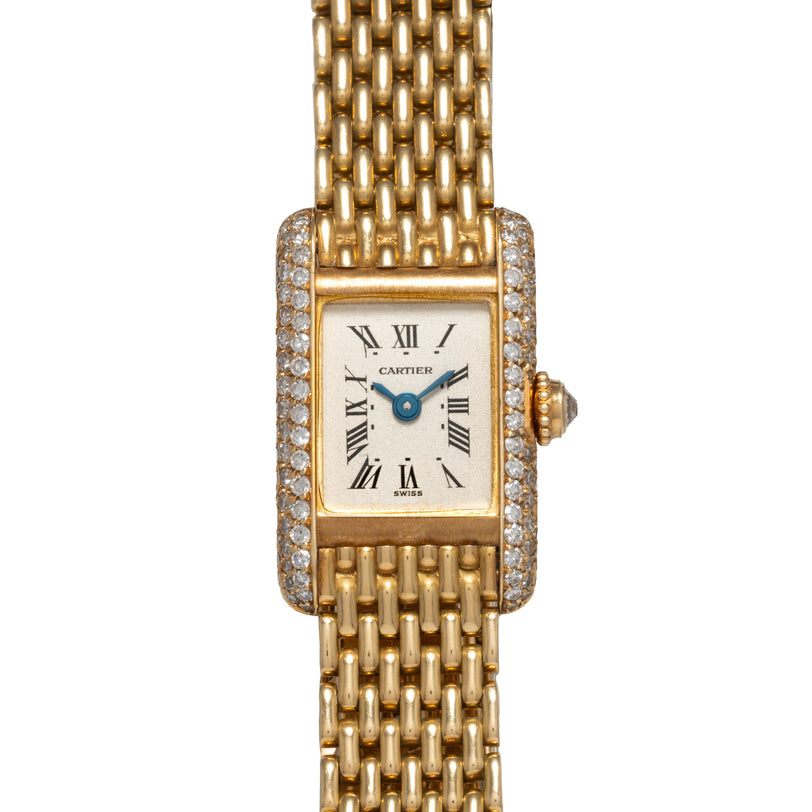 Cartier Tank Louis Mini Diamonds watch featuring a rectangular face, Roman numerals, and diamond accents on the bezel and bracelet.