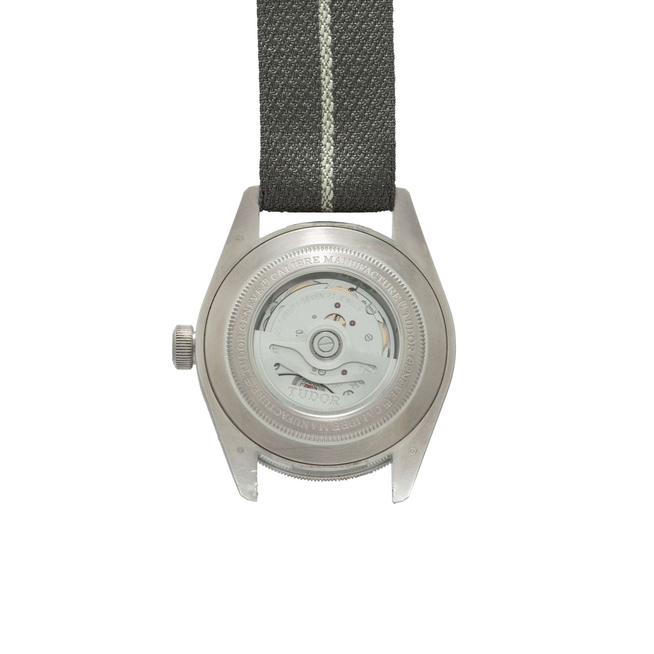 Back view of the TUDOR Black Bay 58 Silver watch, featuring a visible automatic movement and a black fabric strap.