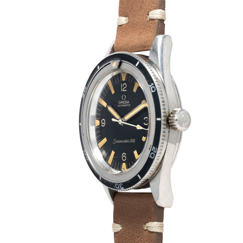 A side view of the OMEGA Seamaster 300, featuring a black dial and brown leather strap.