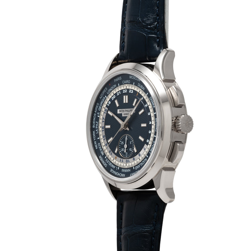 Side view of the Patek Philippe World Time Chronograph, a luxury wristwatch featuring a black leather strap and a dial displaying multiple world cities.