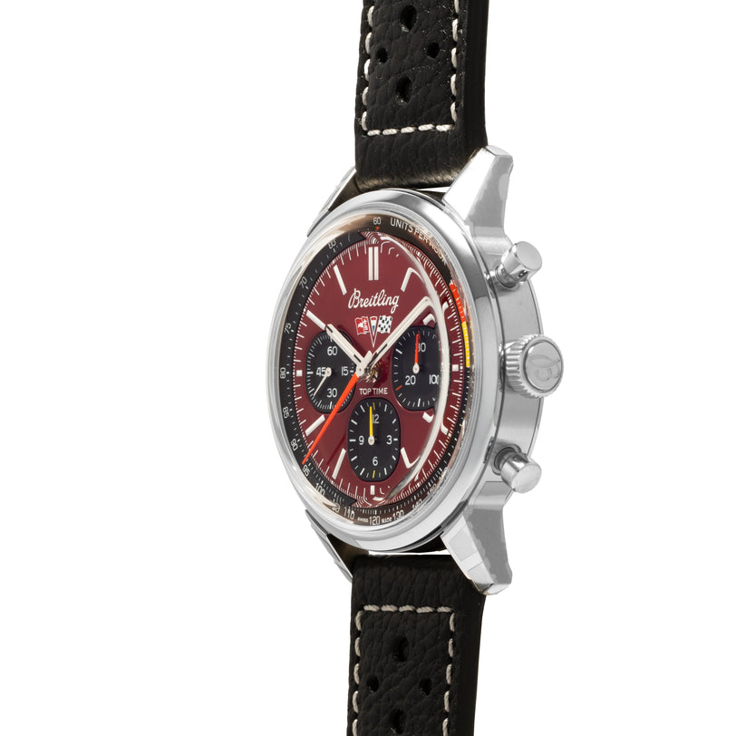 The Breitling Top Time B01 Chronograph Chevrolet Corvette features a red dial, black leather strap, and silver case, shown here from the side.