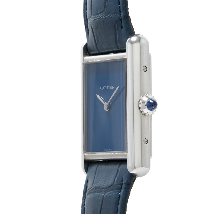 Cartier Tank Must watch featuring a blue face, blue leather strap, and silver case, displayed from a side angle.