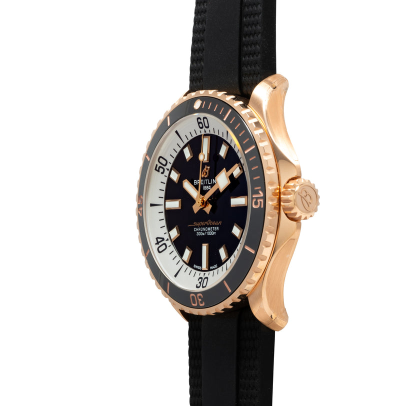 Breitling Superocean Automatic 42 wristwatch with black face, black band, and prominent bezel, shown from a side angle.