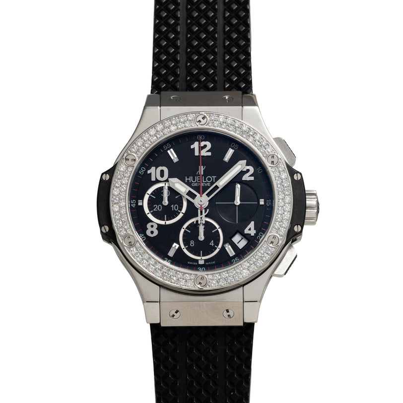 Steel chronograph watch with diamond-set bezel, black dial, and black rubber strap.