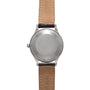 A Jaeger-LeCoultre 'European Market' Powermatic wristwatch with a round, blank silver back case and brown leather straps, shown from the back. The vintage-inspired design features no visible branding or markings on the case.
