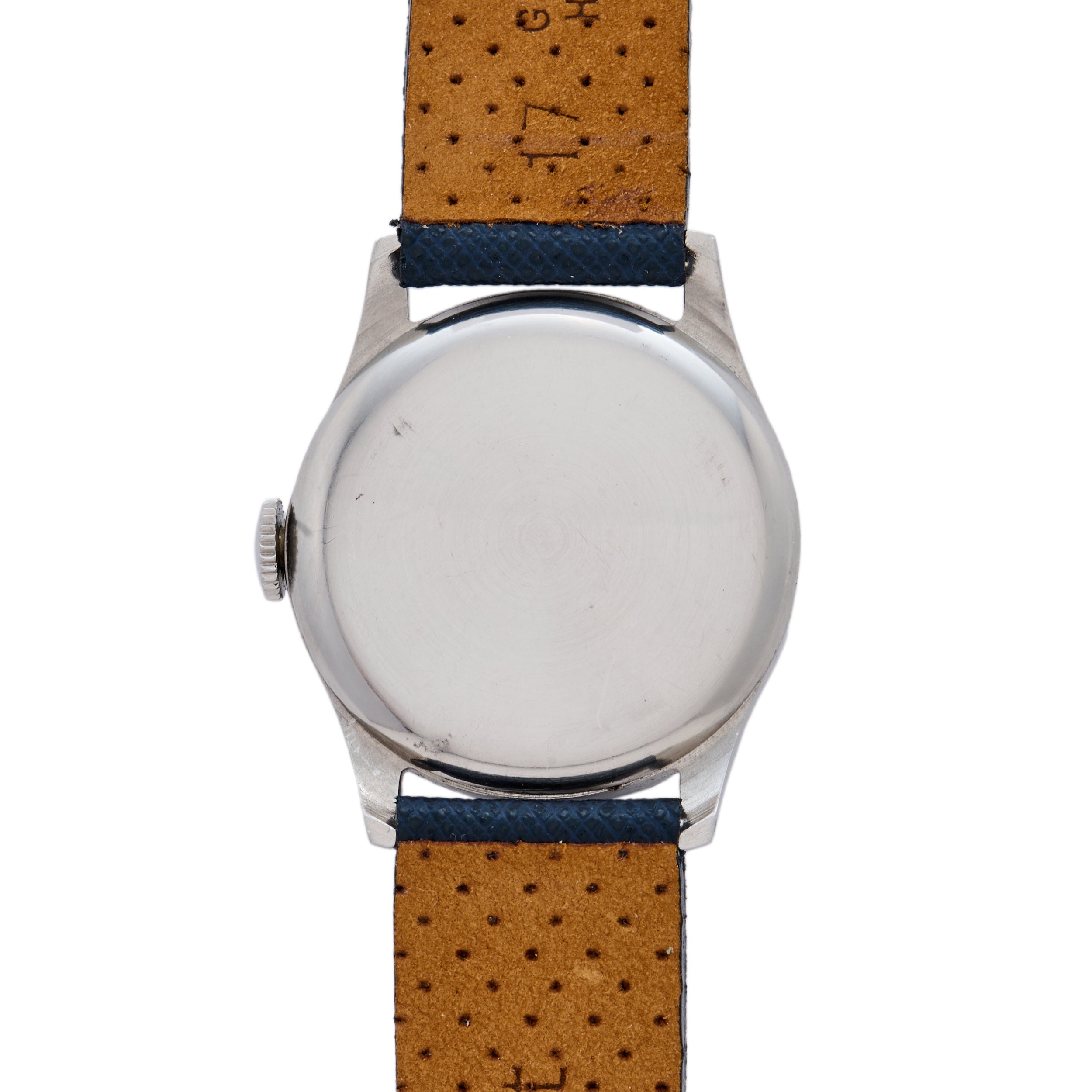 The image displays the back of a Movado 'Calatrava' Steel watch with a plain silver case and a tan leather strap with blue-edged, perforated holes. The crown is on the left, exemplifying classic Movado Swiss craftsmanship.