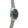 Seiko chronograph with black dial, blue and red bezel, date window, and stainless steel bracelet.