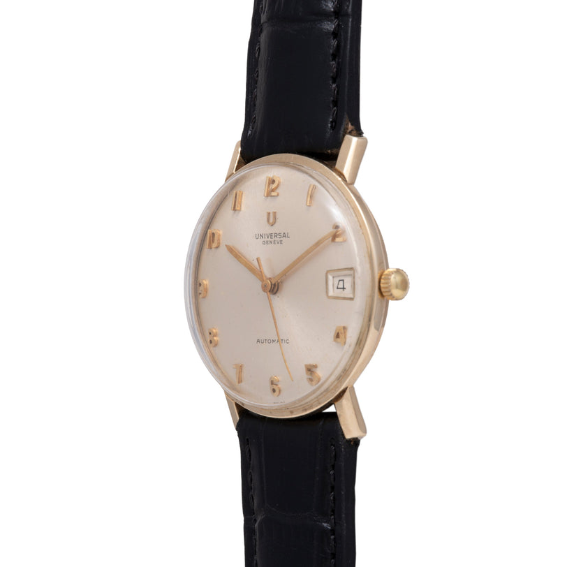 Universal Geneve wristwatch with cream dial, gold-tone numerals, date window, and black leather strap.