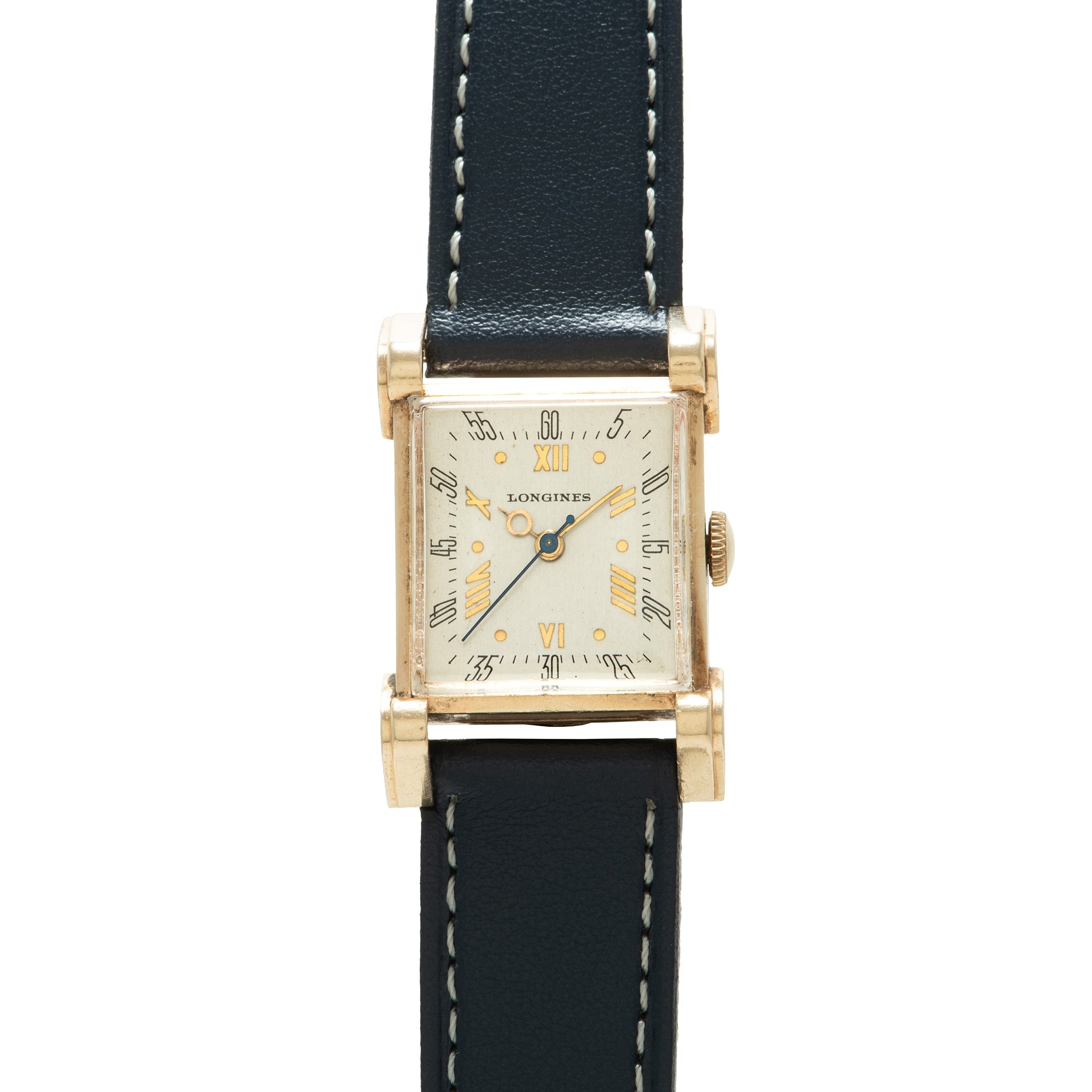 Longines Tank watch with rectangular cream dial, Roman numerals, hooded lugs, and black leather strap with white stitching.
