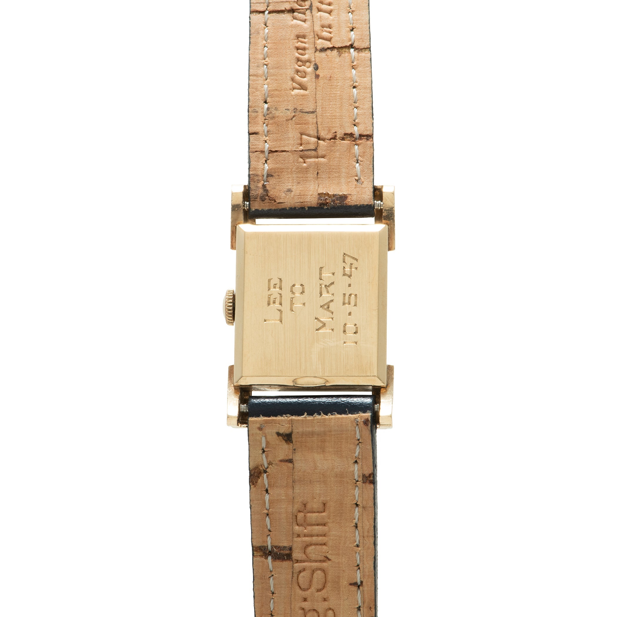 Gold-tone rectangular watch case with hooded lugs attached to tan crocodile leather strap.