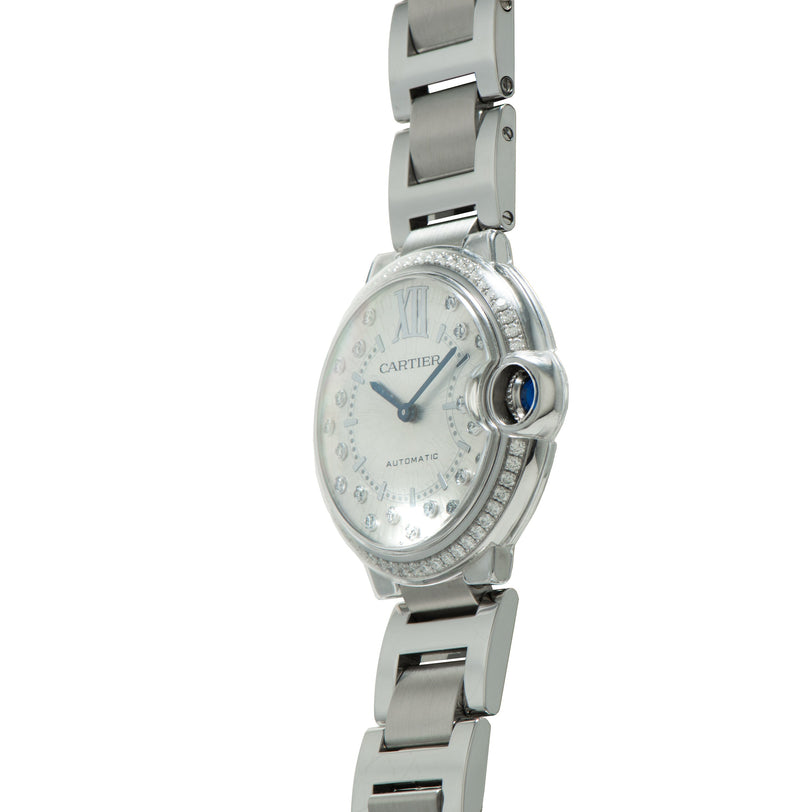 Cartier Ballon Bleu watch with white dial, diamond bezel, blue crown, and stainless steel bracelet.