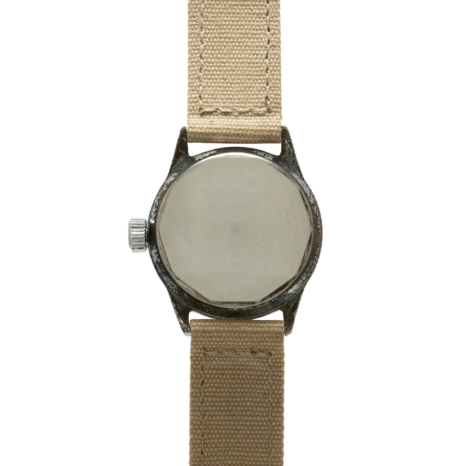 Watch with dark metal case, blank silver dial, and tan canvas strap.