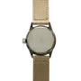 Watch with dark metal case, blank silver dial, and tan canvas strap.