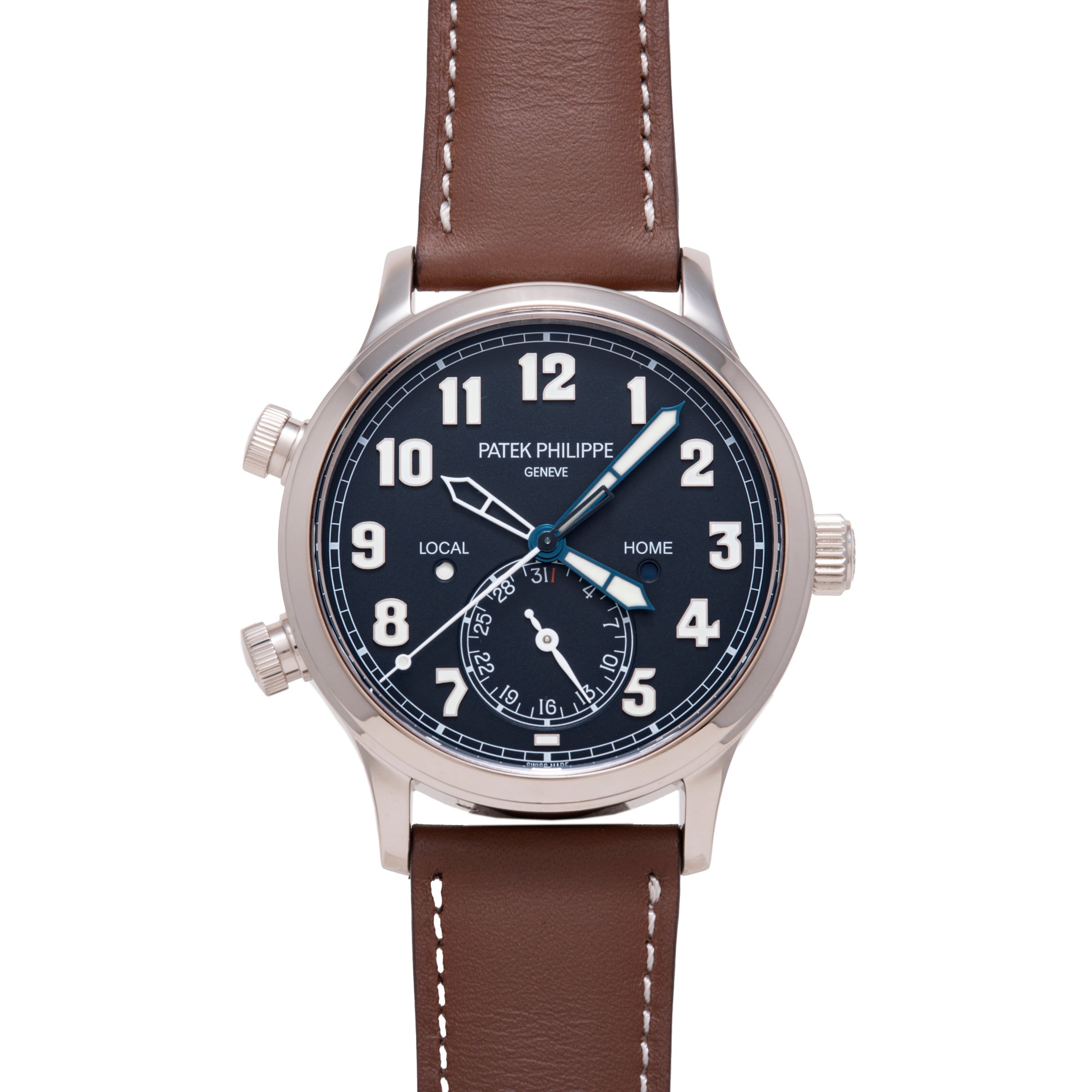 Patek Philippe Calatrava Pilot Travel Time watch with dark dial, dual time zones, brown leather strap, and steel case.