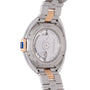 Cartier watch back showing stainless steel case, two-tone bracelet, and visible automatic movement through sapphire crystal.