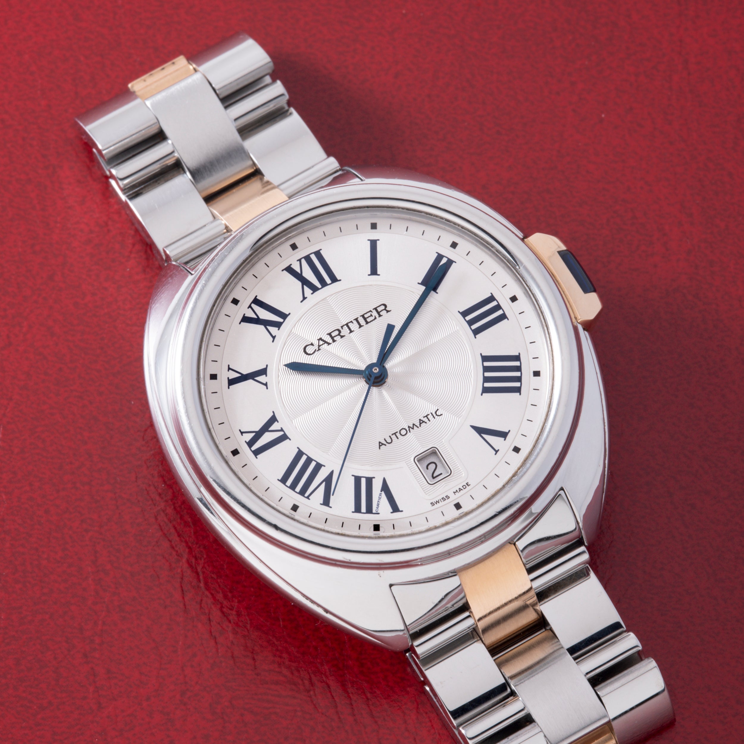 Cartier Clé de Cartier automatic watch with two-tone stainless steel and rose gold bracelet, white dial with Roman numerals a
