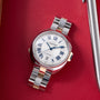 Cartier Clé de Cartier automatic watch with white dial, Roman numerals, steel and rose gold two-tone bracelet on red fabric b