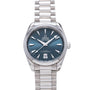 Omega Seamaster watch with blue dial, white hour markers, date window, and stainless steel bracelet.