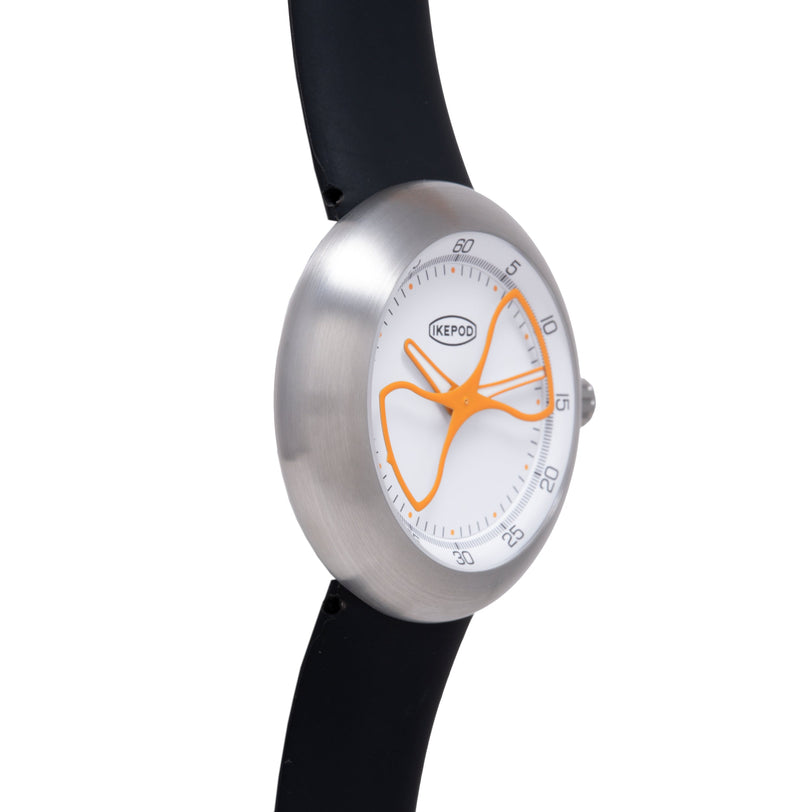 Ikepod Megapod watch with brushed silver case, white dial featuring orange hourglass design, and black strap.