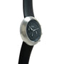 Ikepod Chronopod chronograph with brushed stainless steel case, black dial, and black rubber strap.