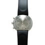 Stainless steel chronograph watch with black rubber strap, viewed from the case back showing engraved text and red chronograp