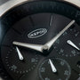 Black dial chronograph watch with silver hands, IKEPOD logo, subdials, and tachymeter scale on bezel.