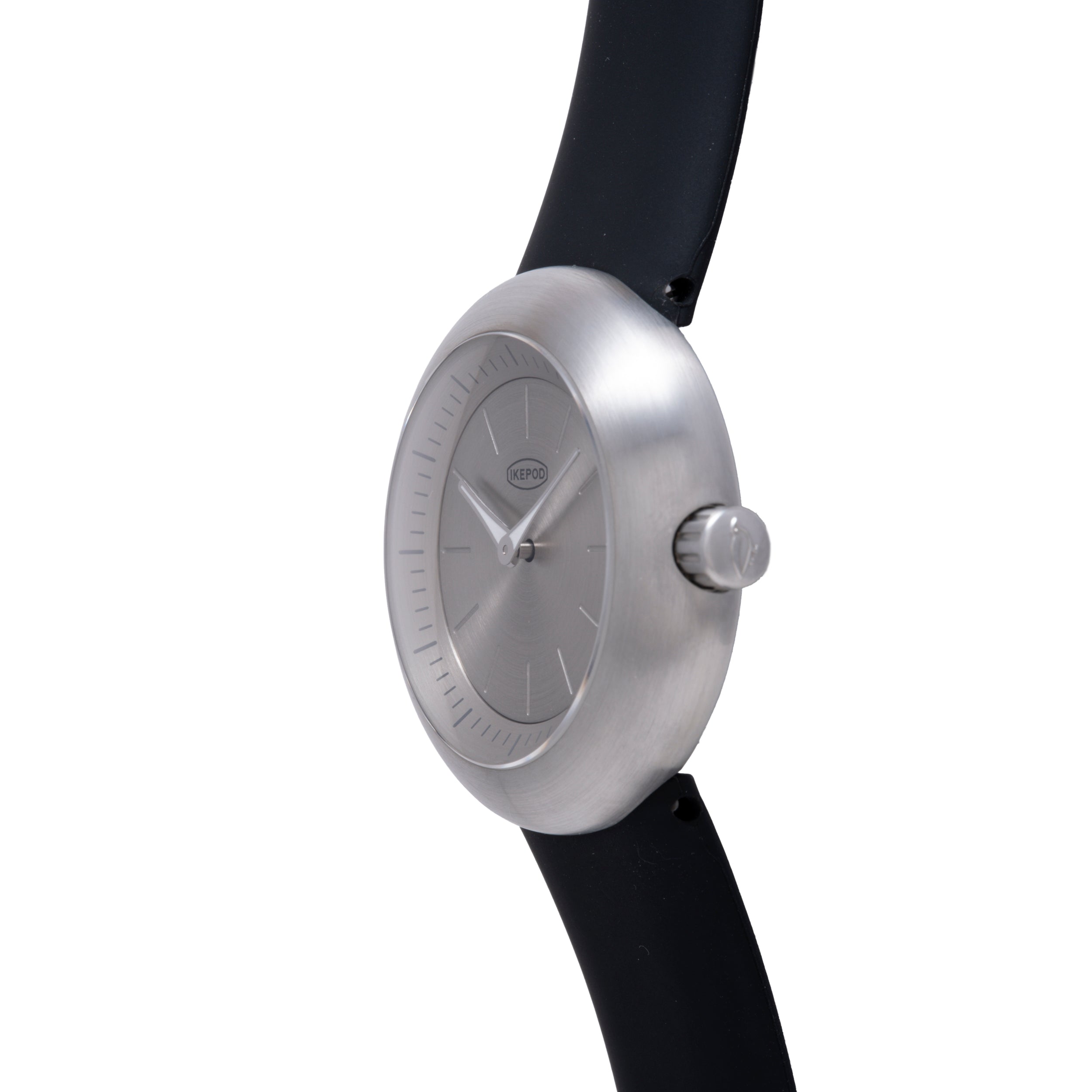 Silver-brushed round watch with minimalist dial, hour markers, and black rubber strap.