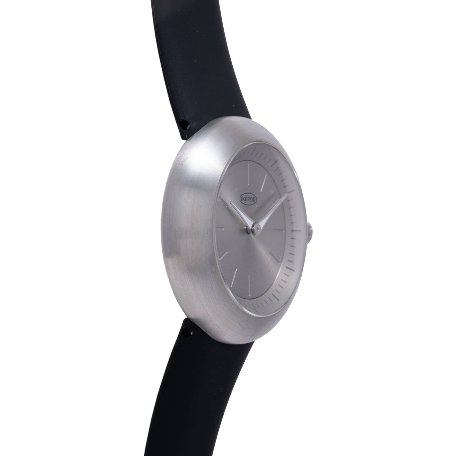 Brushed silver watch with minimalist dial, hour markers, and black rubber strap.