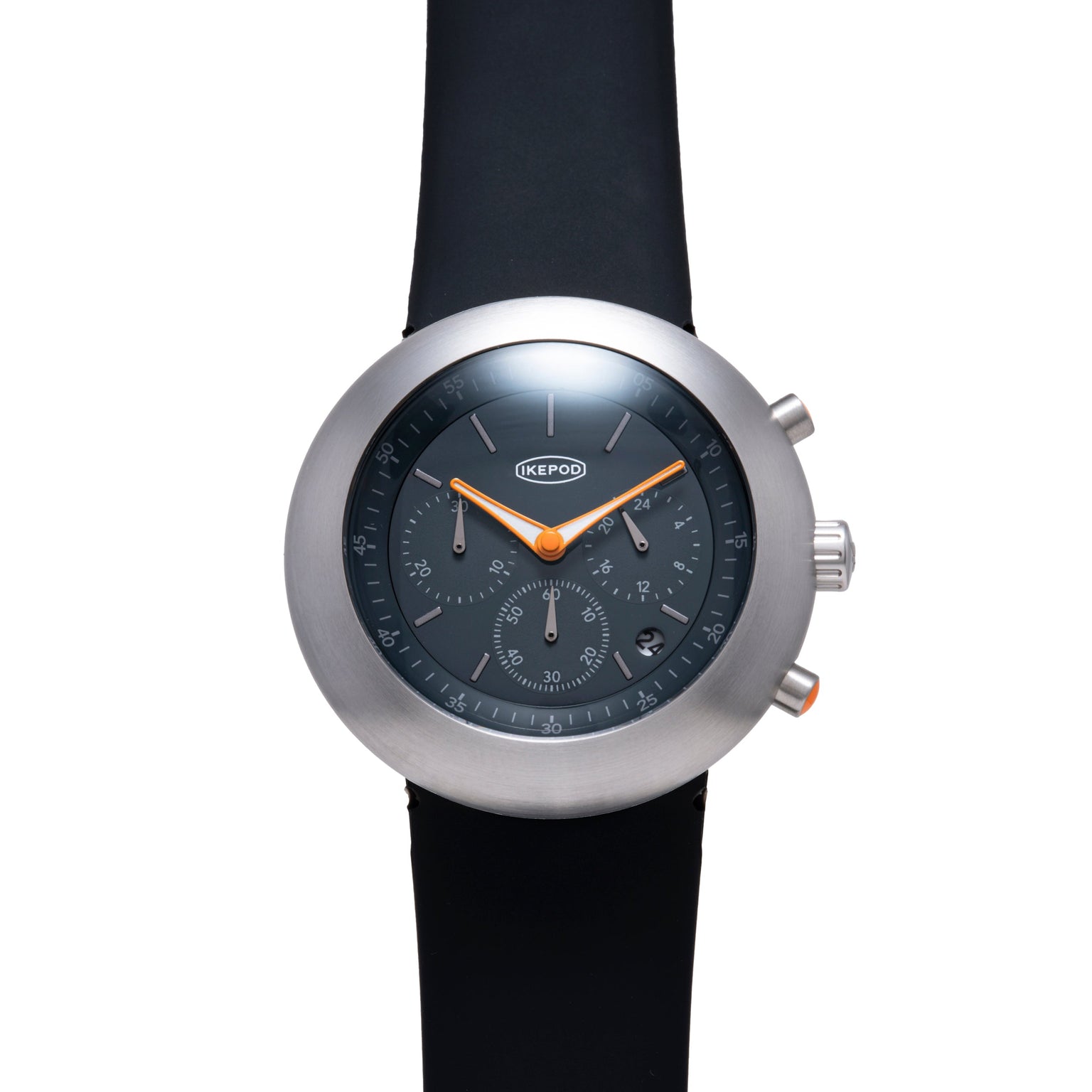 Ikepod Chronopod watch with brushed steel case, dark dial, orange hands, and black rubber strap.