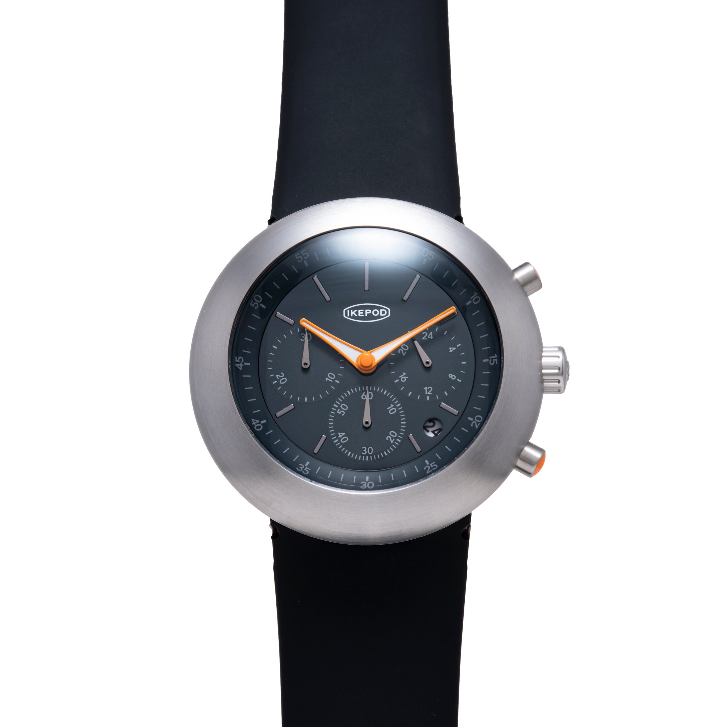 Ikepod Chronopod watch with brushed steel case, dark dial, orange hands, and black rubber strap.