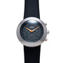 Ikepod Chronopod watch with brushed steel case, dark dial, orange hands, and black rubber strap.