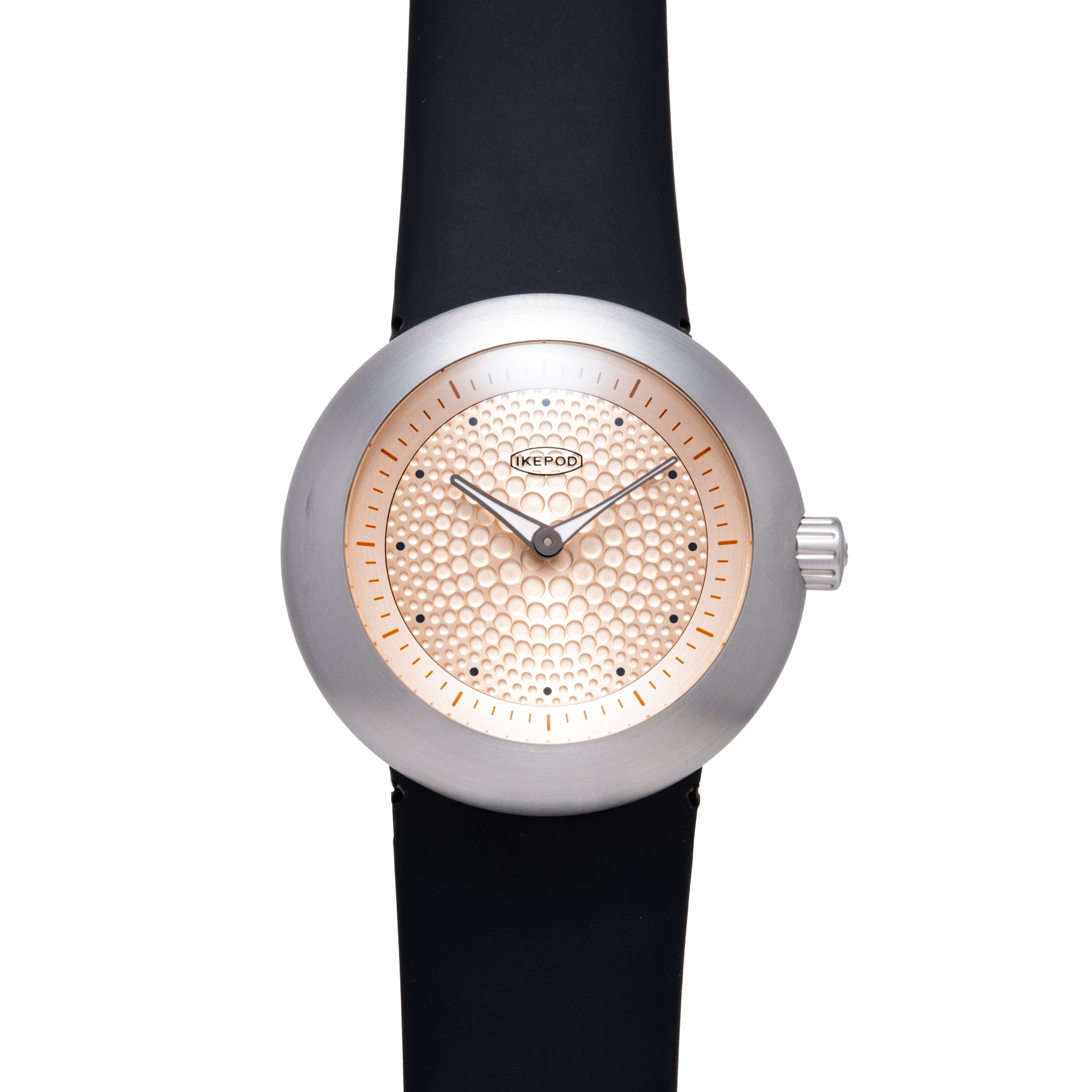 Ikepod Duopod watch with silver case, rose gold dot-patterned dial, black leather strap, and hour markers.