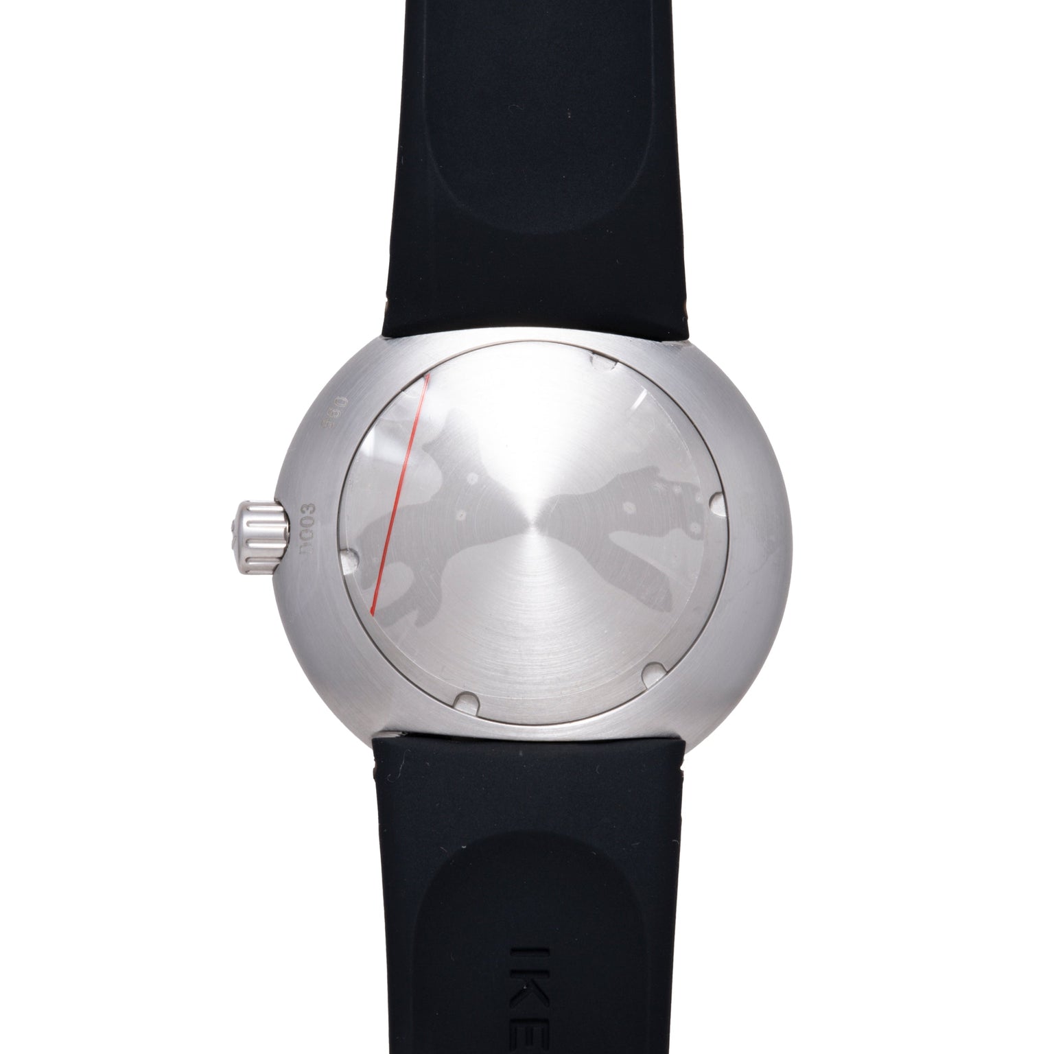 Round silver watch with brushed metal face, red indicator line, small gold dots, and black rubber strap.