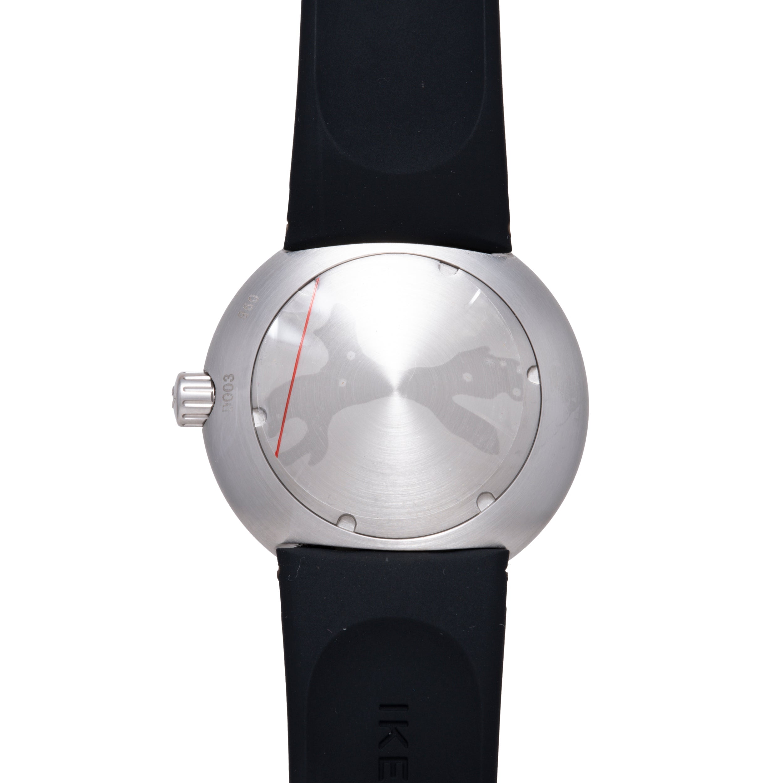 Round silver watch with brushed metal face, red indicator line, small gold dots, and black rubber strap.