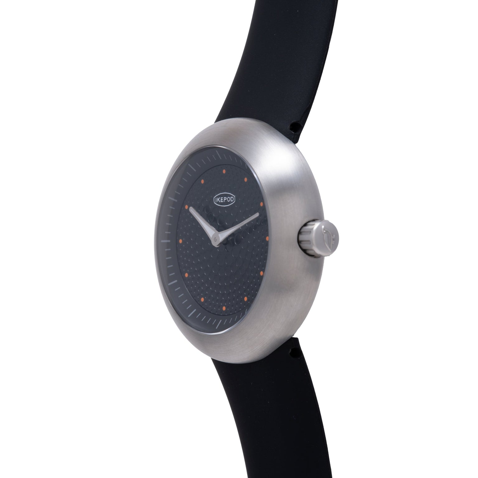 Ikepod Duopod Dots 004 watch with brushed steel case, black dial with orange dot indices, and black rubber strap.