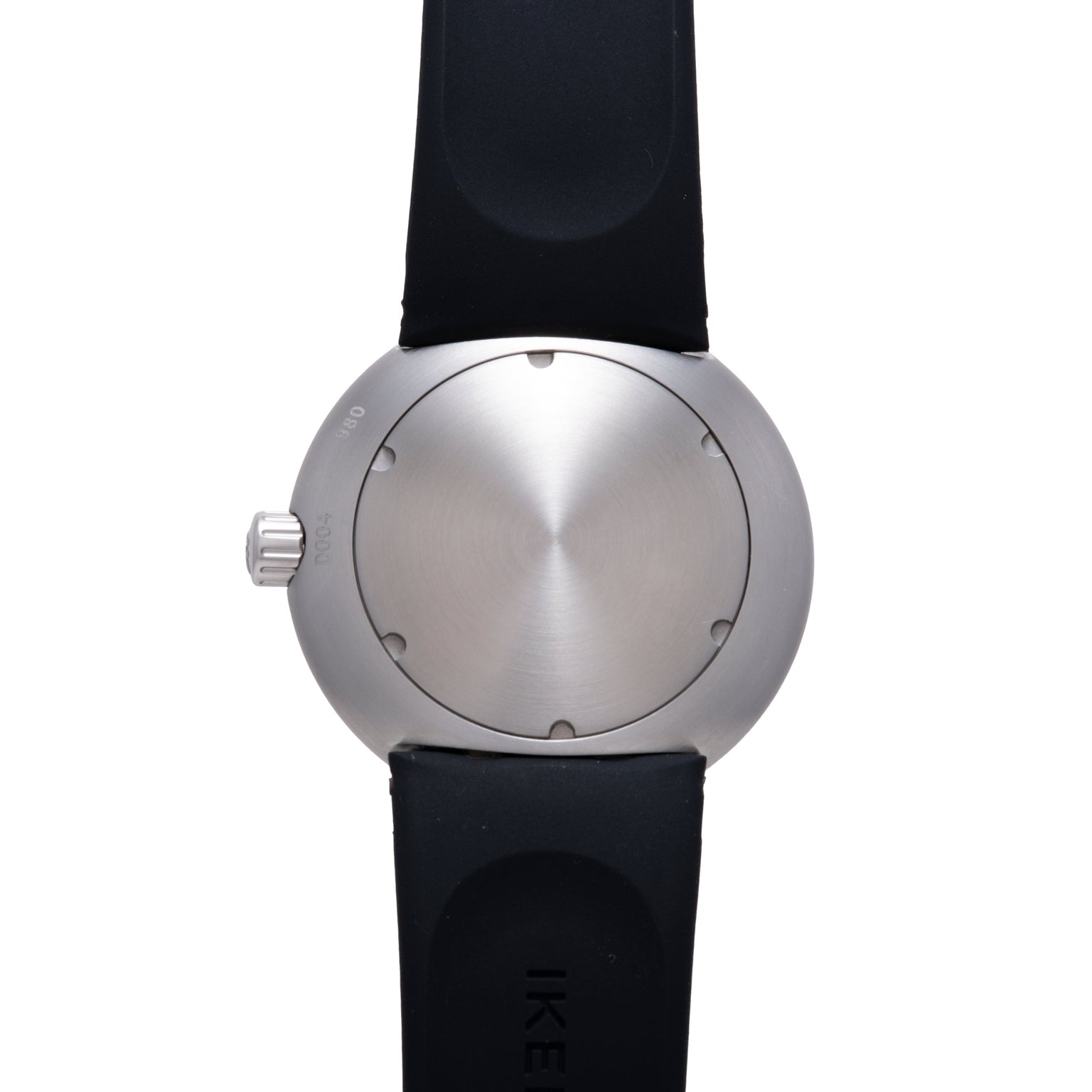 Silver-toned spherical watch with brushed metal face, small dot markers, crown on side, and black rubber strap.