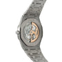 Stainless steel Royal Oak watch with exposed skeleton dial showing gold-toned mechanical movement and integrated metal bracel
