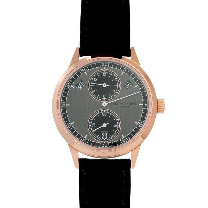 Rose gold watch with grey dial, regulator layout, two subdials, and black leather strap.
