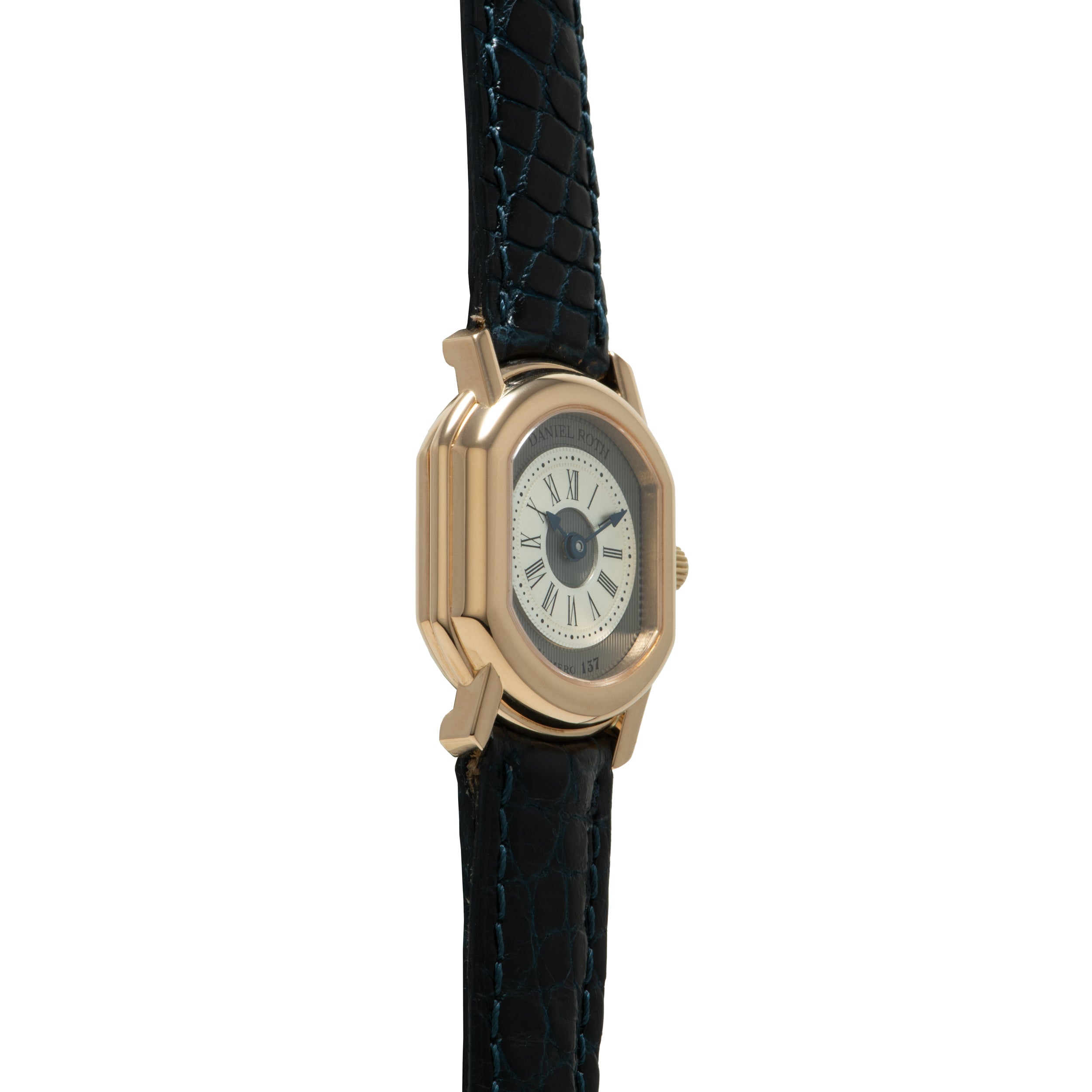 Gold-tone watch with rectangular case, cream dial, Roman numerals, and black crocodile leather strap.