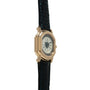 Gold-tone watch with rectangular case, cream dial, Roman numerals, and black crocodile leather strap.