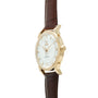 Gold-tone watch with white dial, applied hour markers, and brown leather strap with crocodile texture.