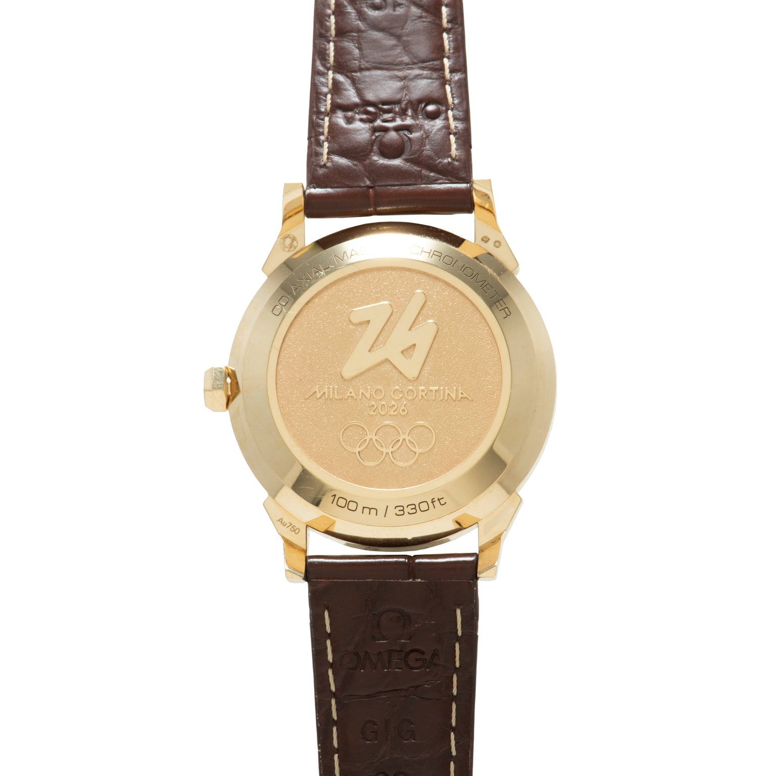Gold-tone watch with brown leather strap, engraved caseback showing Milano Cortina 2026 Olympic rings and 100m/330ft water re