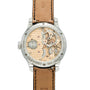 Stainless steel watch with exposed rose gold skeletonized movement, tan leather strap with dark stitching, and engraved bezel