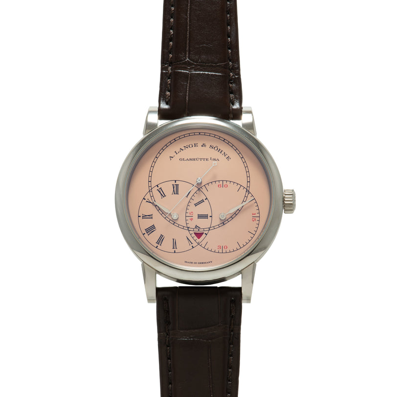 A. Lange & Söhne wristwatch with pink dial, Roman numerals, subsidiary dials, and dark brown leather strap.