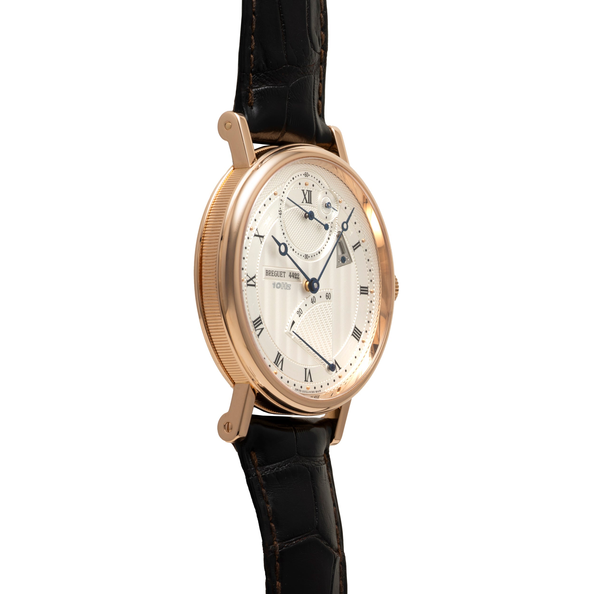 Rose gold watch with cream dial, Roman numerals, multiple subdials, and black leather strap.