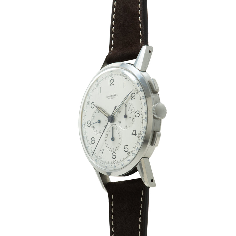Universal Genève Jumbo Compax chronograph watch with silver case, white dial, and black leather strap.