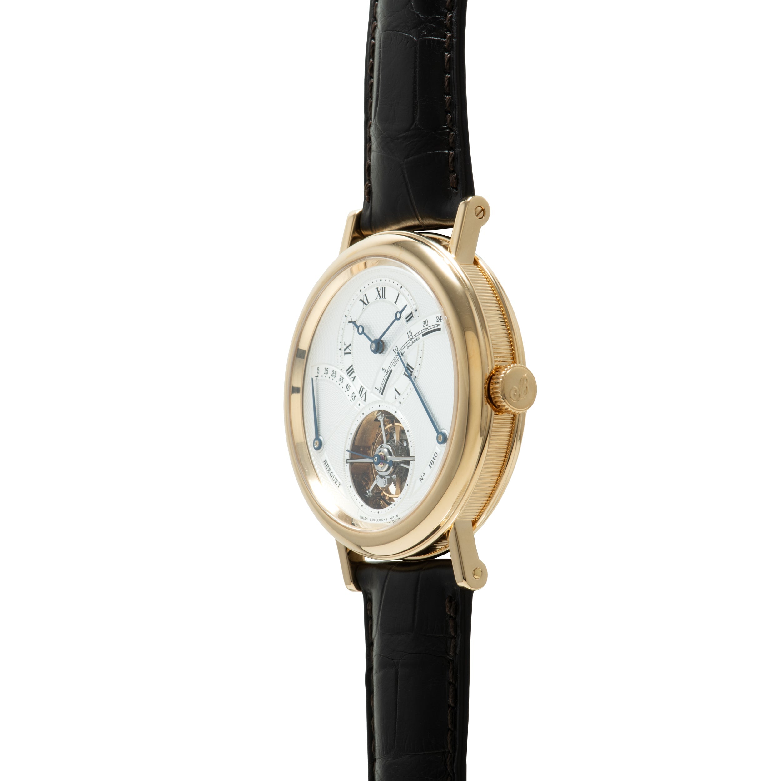 Gold-toned oval watch with white dial, Roman numerals, visible tourbillon escapement at bottom, and black crocodile leather s